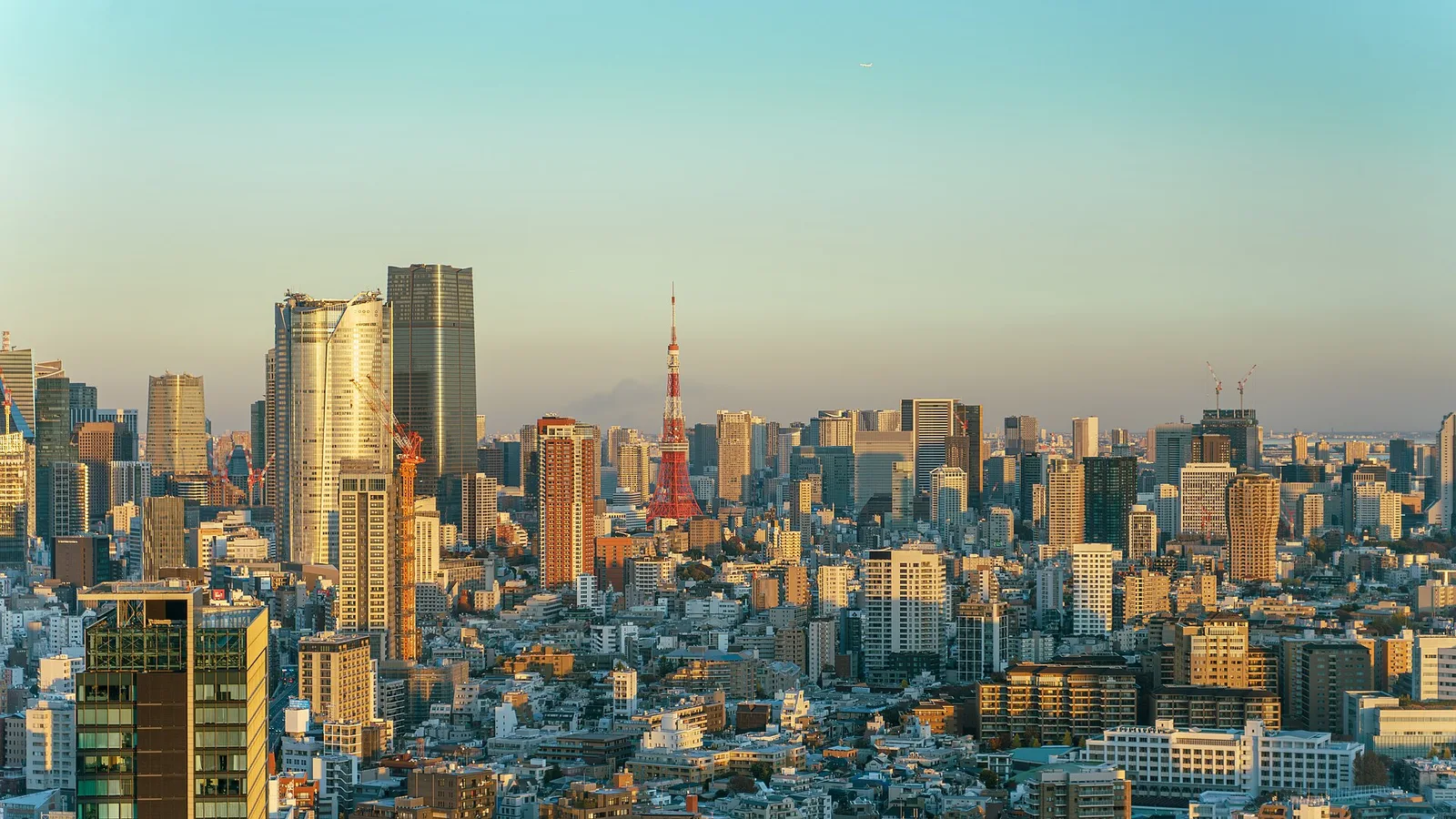 Tokyo's Minato skyline in golden-hour light, used as archival city atmosphere