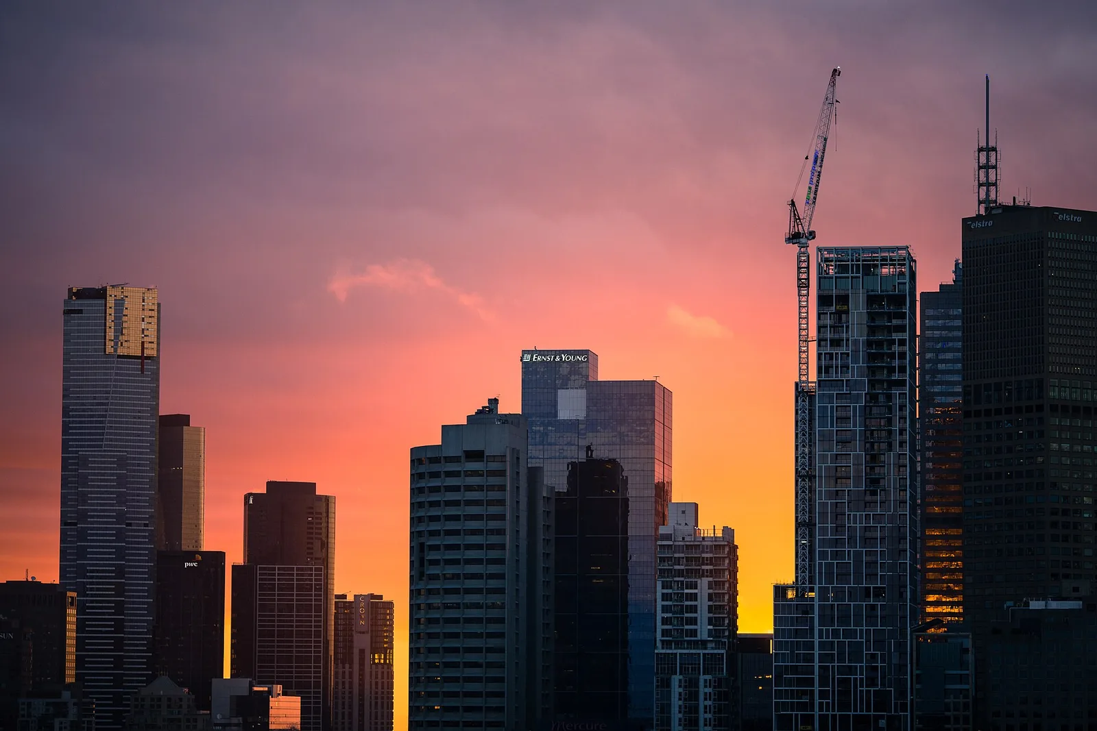 Melbourne skyline at sunset (Unsplash); archival destination atmosphere, not a photograph of the upcoming race