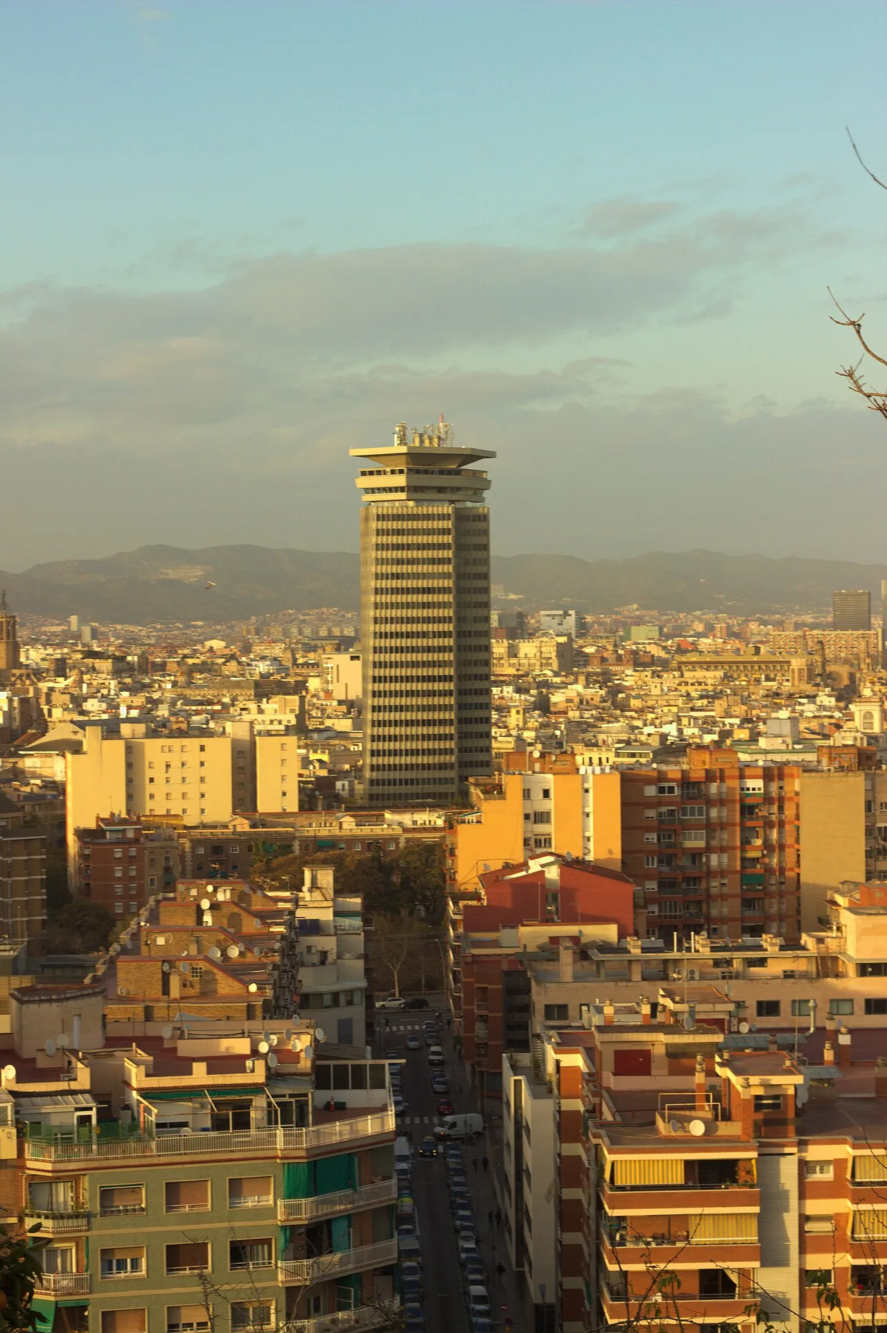 Barcelona skyline in warm evening light, photographed from Mirador del Poble Sec in March 2017; archival city atmosphere