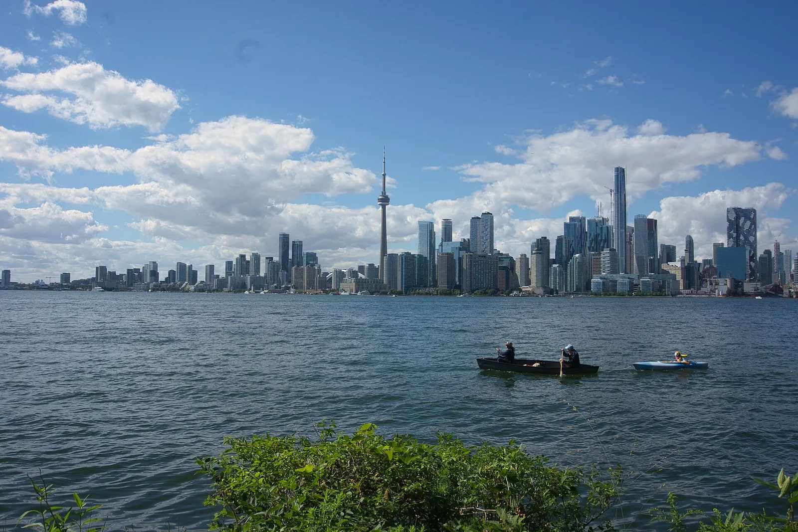 Archival Toronto skyline and CN Tower seen across the water with kayakers